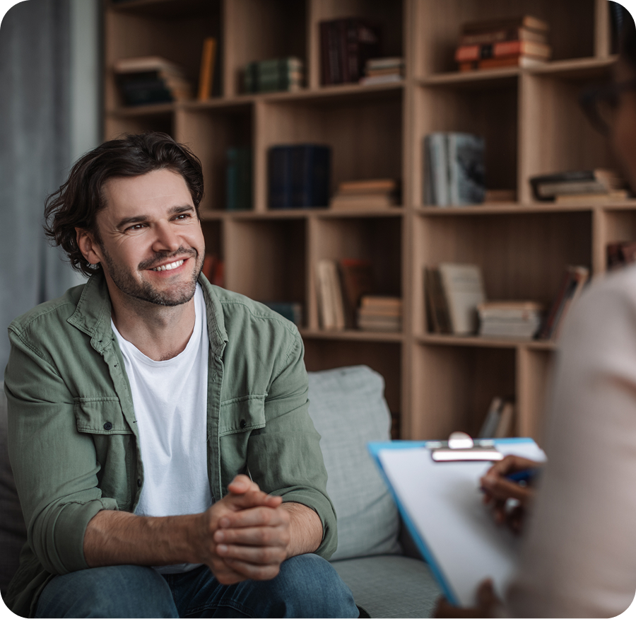 Man smiling during a therapy session.